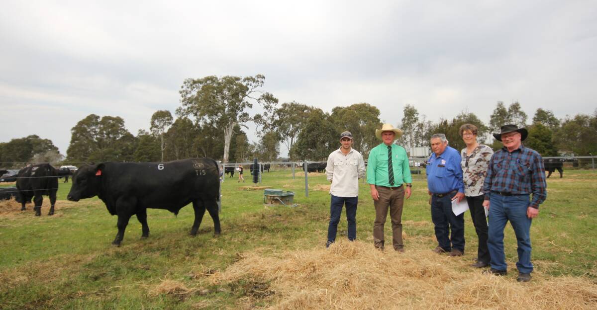 Leawood Angus stud principal Luke Stuckey, Flynn Nutrien stud stock manager Peter Godbolt, Phelan & Henderson & Co director David Phelan, Yarram, buyers Maree Avery and Kevin Opray, Hedley, with top price bull Lot 6. Picture by Holly McGuinness