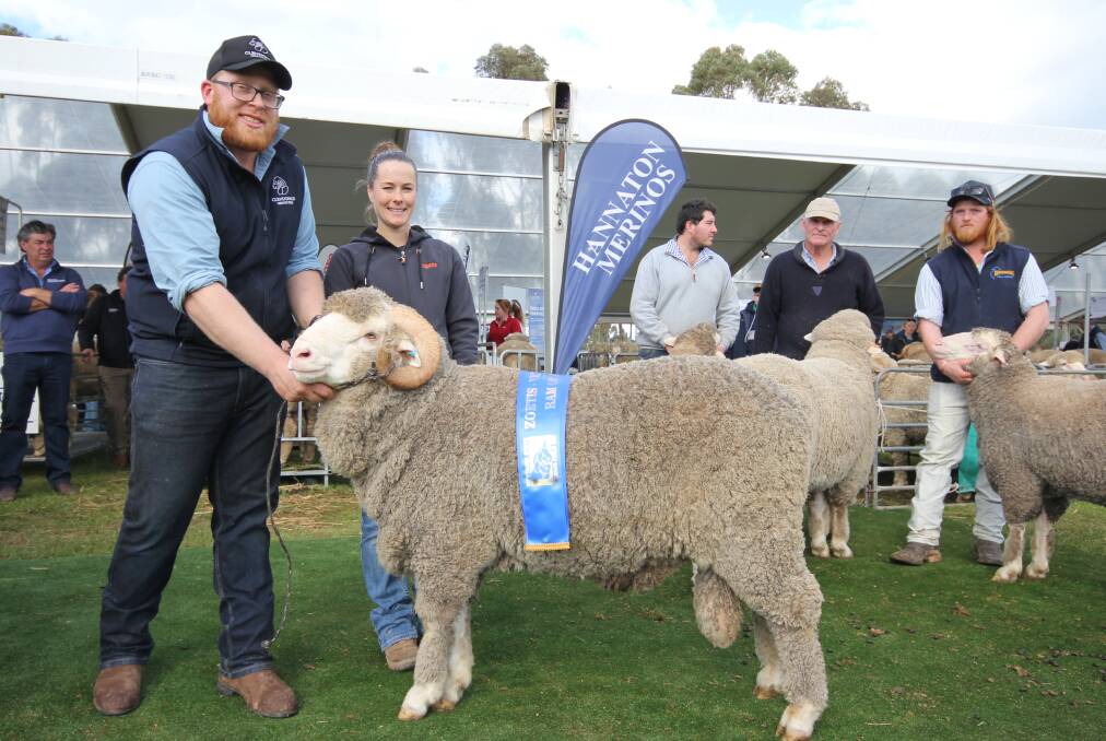 Jamie Harding and Zoetis representative Heidi Sutherland with the winning Victorian Hogget Ram of the Year, awarded to Glendonald Merino stud, Nhill. Picture by Holly McGuinness