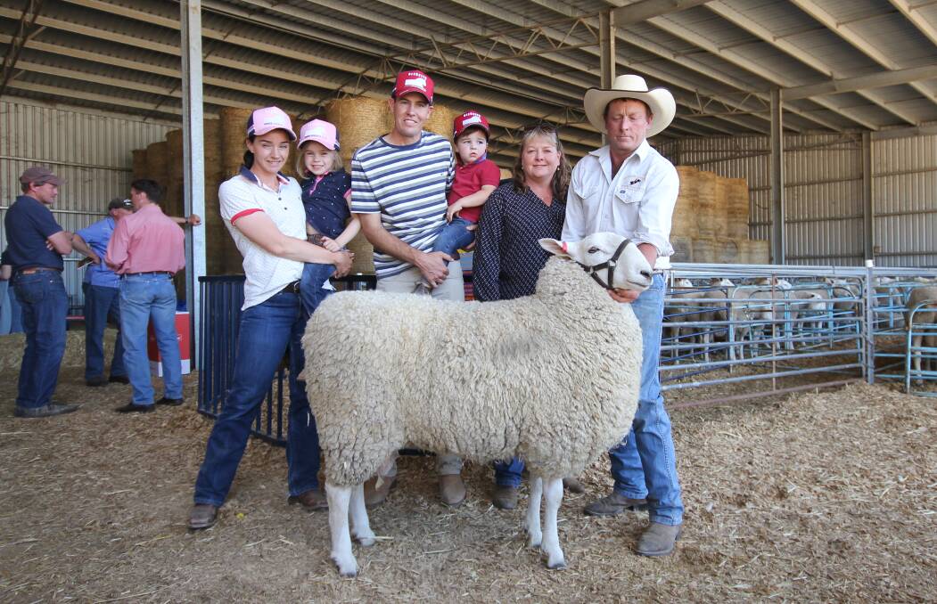 Rachael, Annabelle, Nathan and Jackson Kember, Gleneith Border Leicester, Ganmain, NSW and Lydia and Ross Jackson, Jackson Farming, Moysten, with top priced ram Lot 13. Picture by Holly McGuinness 