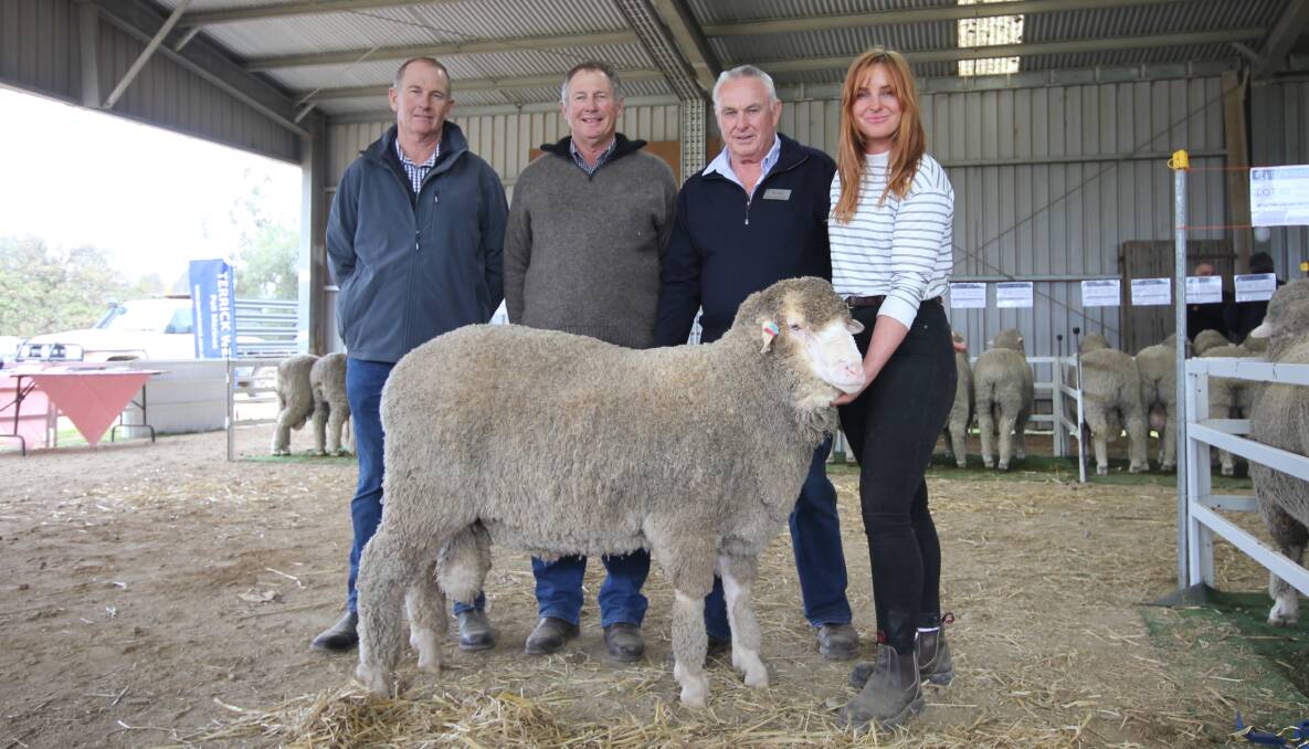 Dunedin Park Poll Merino stud principals Warren and Stuart Duncan, Wentworth, NSW, with Terrick West stud co-principals Ross and Claire McGauchie, Prairie, and the top-priced ram. Picture by Holly McGuinness