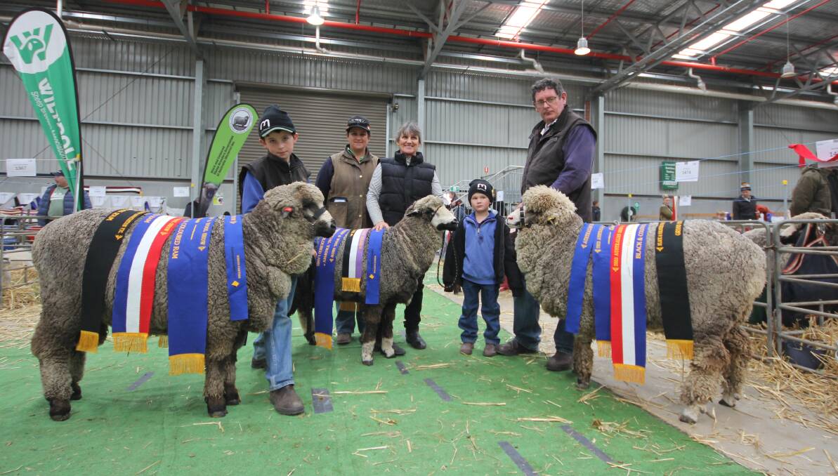 Harry Wilson, Melody Wilson, Anne Barnes, Charlie Wilson and Ashley Wilson with their winning champion grand ram, ewe and lamb from Werowna Park, Yass. Picture by Holly McGuinness