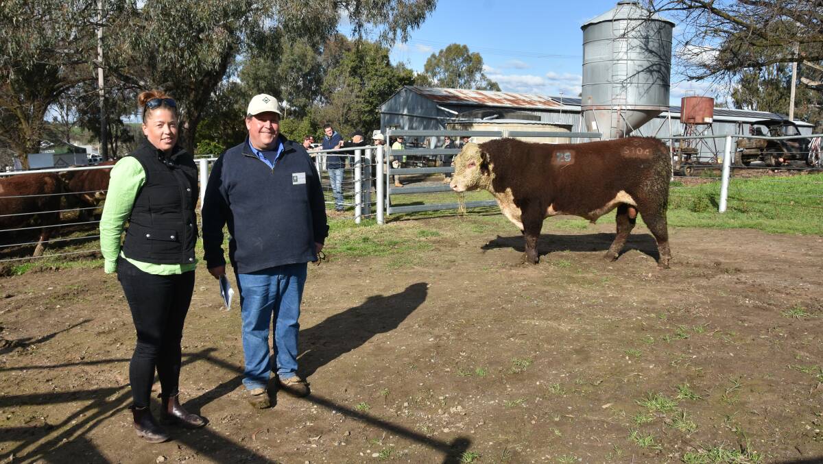 Top priced bull of the sale Wirruna Seaview S104, sold for $16,000 with purchaser Jenna Burden, Burden Family Trust, Camiambo, Vic and Wirruna Poll Hereford stud principal, Ian Locke. 