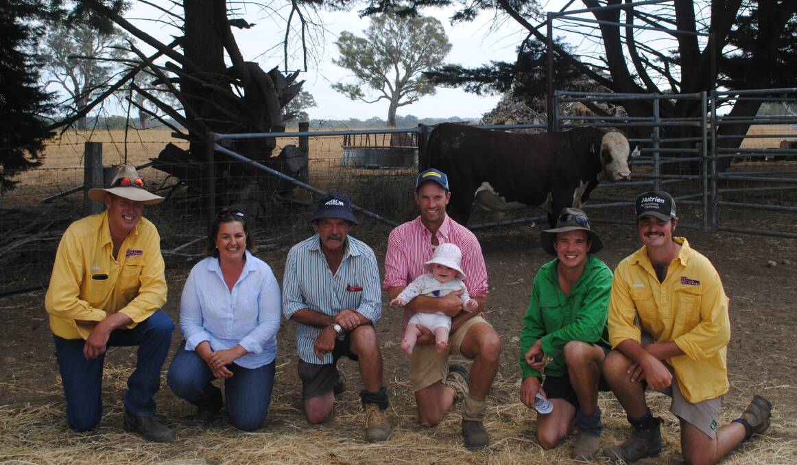 Wilkah Herefords stud principal Andrew Lyons, Vasey, with his wife Angela, the buyers of his top-priced bull, John, Will and Joel Staude, Pigeon Pond, Will's daughter Sally (8 months), and Will Lyons, Vasey. Picture by Barry Murphy