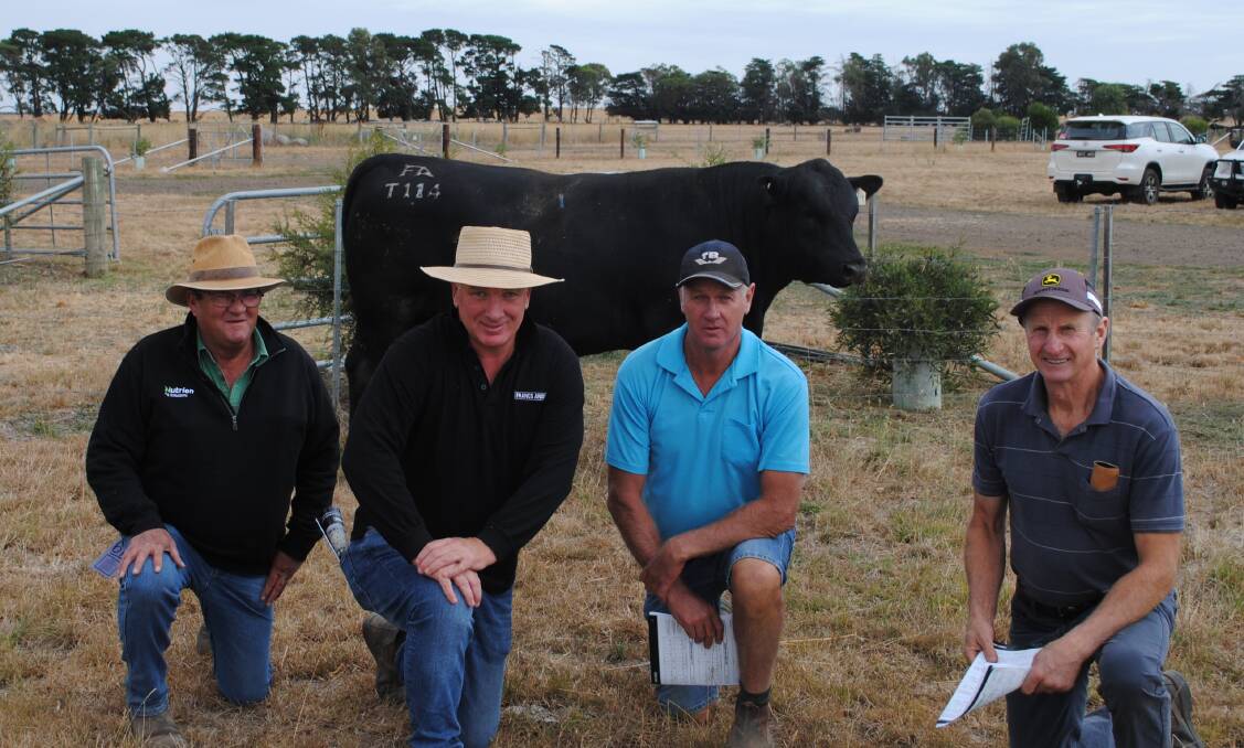Nutrien Ballarat agent John McKinnon, Ballarat, with Francs Angus stud co-principal Nick Franc, Beaufort, and buyers of his top-priced bull, Bruce and Stuwart Richardson, Newlyn. Picture by Barry Murphy 