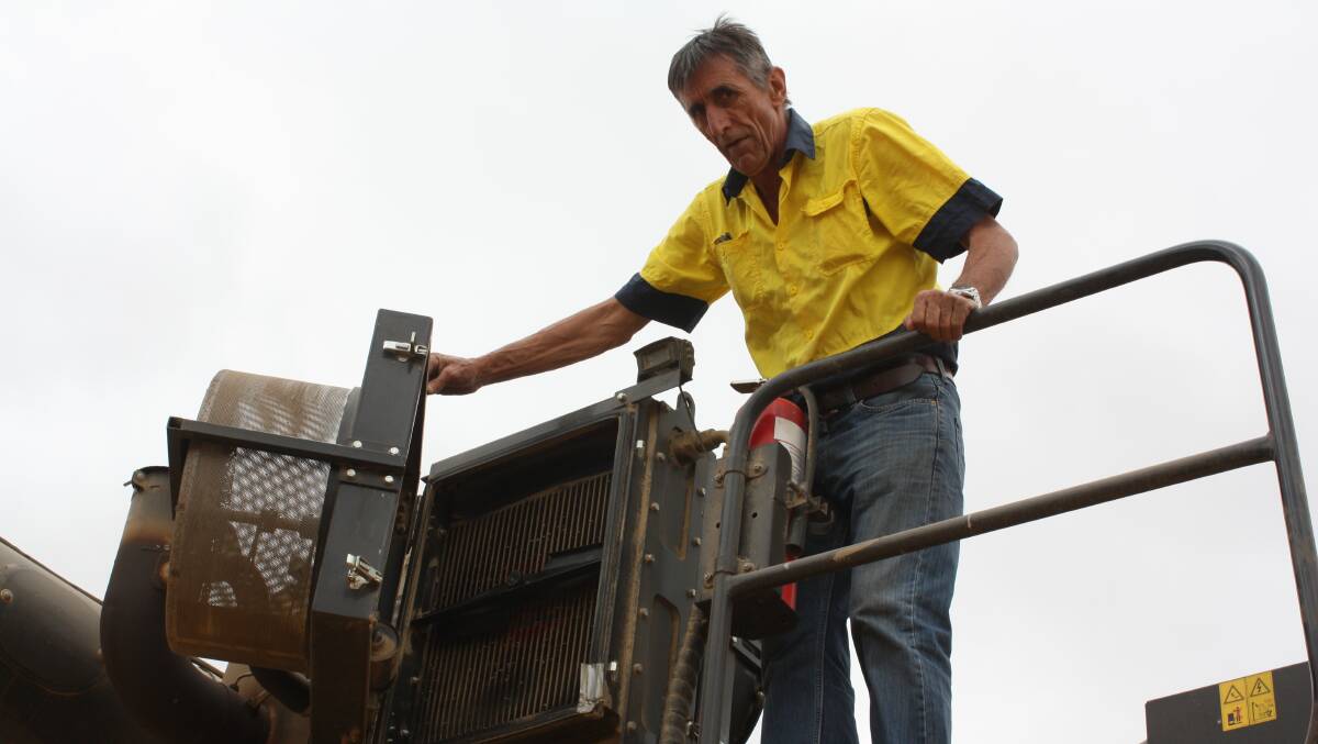 Beaumont, WA, grower Steve Mansell checks out the development of the integrated Harrington Seed Destructor.