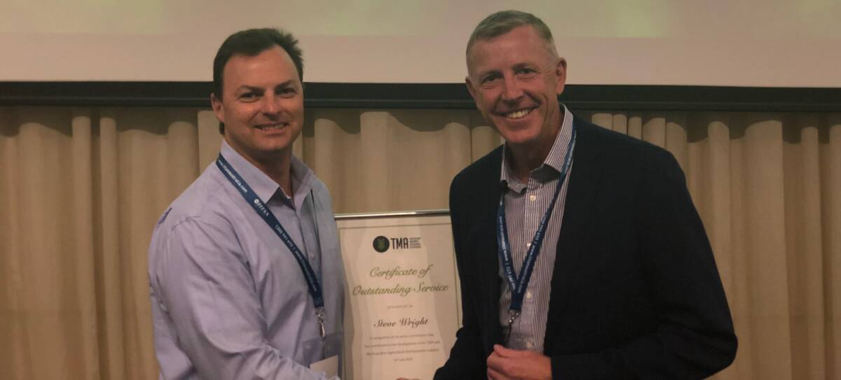 Service award: John Deere's Steve Wright was recognised for his service to industry by Tractor and Machinery Association chair Paul Barry at the annual conference. 