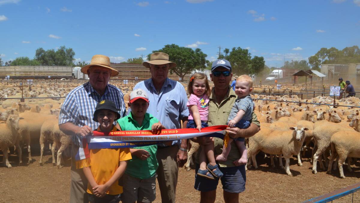 With the best presented pen - Tony Flagg, Rieley and Lily Curran, sponsor Ian Tonacia, S. J Tonacia and Co, Mt Beckom stud, Ardelthan and Matt Flagg holding Jude and Frankie Flagg. The 183 ewes sired by Mt Beckom rams and out One Oak- and Haddon Rig-blood Merino ewes sold for $310 to Crookwell producer.