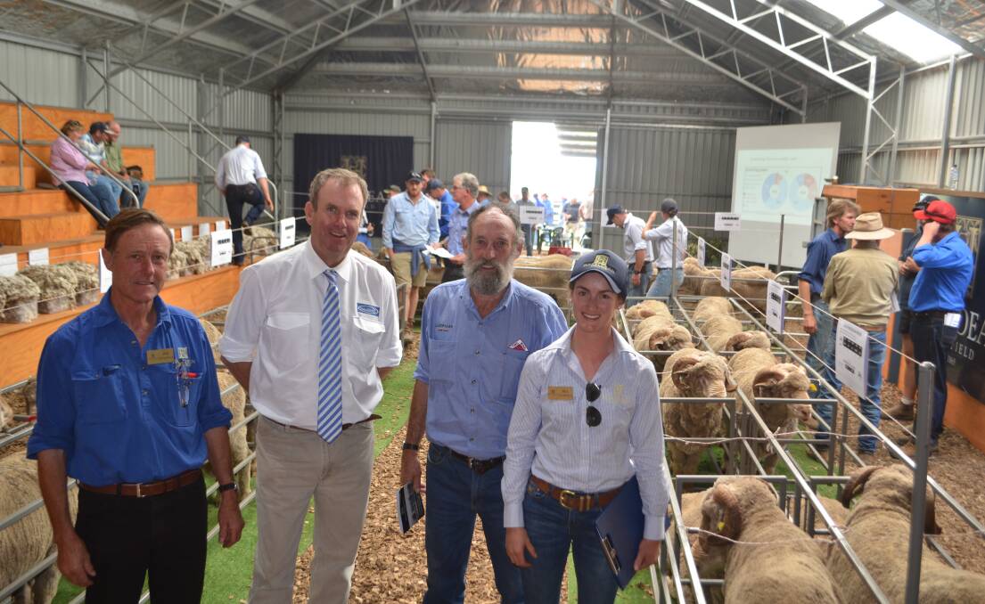 Jim and Bea Litchfield, Hazeldean, Cooma, with guest auctioneer Paul Dooley, Tamworth, and Landmark Cooma livestock agent Brian Sears who purchased the top priced ram for Brett Tremain. Ms Litchfield said they were very happy with the sale and there had been a lot of interest in rams with relevant and profitable data. 