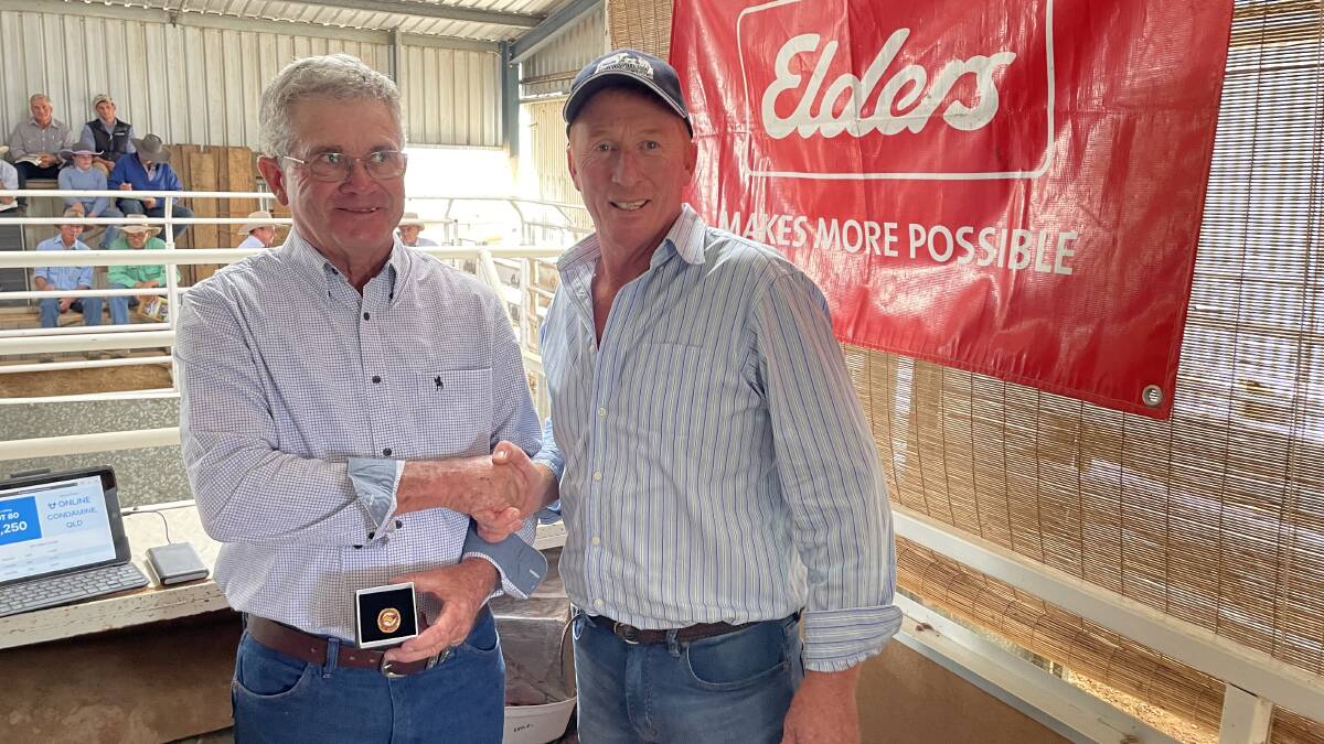 Gerald Spry recieving Life Membership from Chris Thompson.