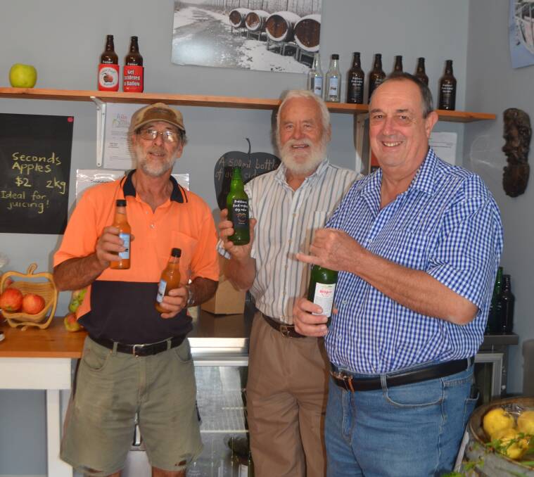 Ralph Wilson, Harald Tietze and Ray Billing enjoy a glass of cider produced and bottled in Batlow