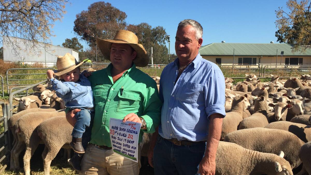 Three generations: Milton, Ryan and Peter Burden with their top priced pen at Narrandera sold to repeat buyer from Mt Gambier, SA.