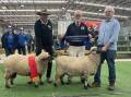 David Pickles, with the reserve grand champion Shropshire ram, judge Gavin Wall, and Phil Pickles with the garnd champion Shropshire ram.