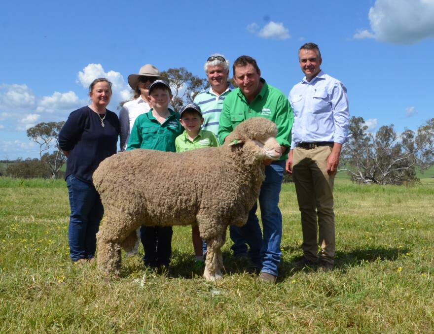 Jane Corkhill, Jane Campbell and her brother-in-law Peter Campbell, Sunnyridge, Frogmore buyers of the top priced ram at $9000, paraded by Mick Corkhill, Grassy Creek, Reids Flat and Mark Hedley, AWN, Goulburn. Toby and Hugh Corkhill are assisting their father with presenting the ram.