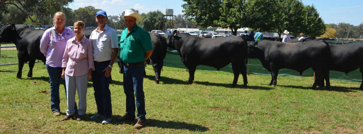 Top-priced bull buyer Helen Olsen, Charters Towers, Qld, with her friends, Lois and Grahame Musk, Charters Towers, and Peter Govan, Rennylea Angus, Culcairn. Rennylea M1172 was bought for his growth, structure and overall appeal.
