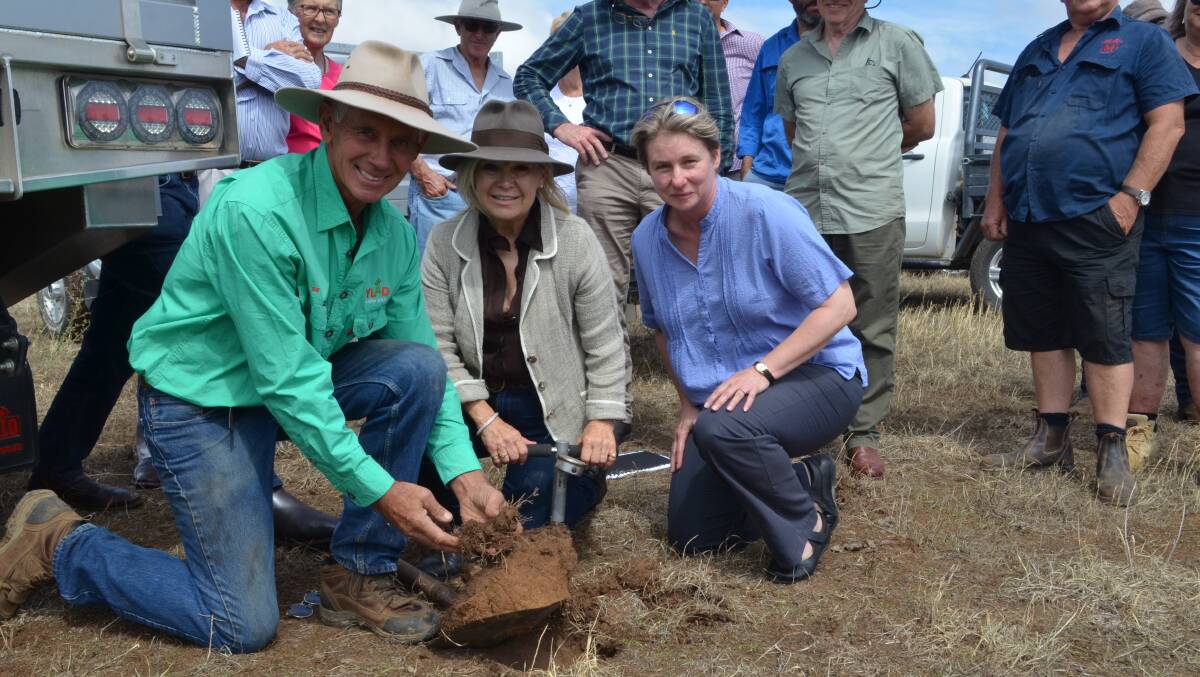 Sweet soil: Bill and Rhonda Daly showing Dr Shane Powell the healthy soil during a field day on their property Milgadara, Young.
