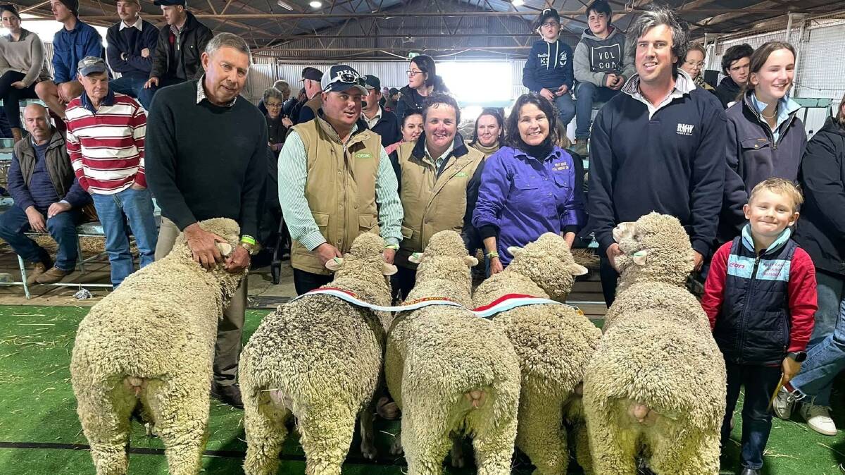The champion pen of flock ewes from Piney Range with Robert Schlig, Shane Foster, Katrina Lieschke, Christine Hall and Ben and Alfie Schlig.