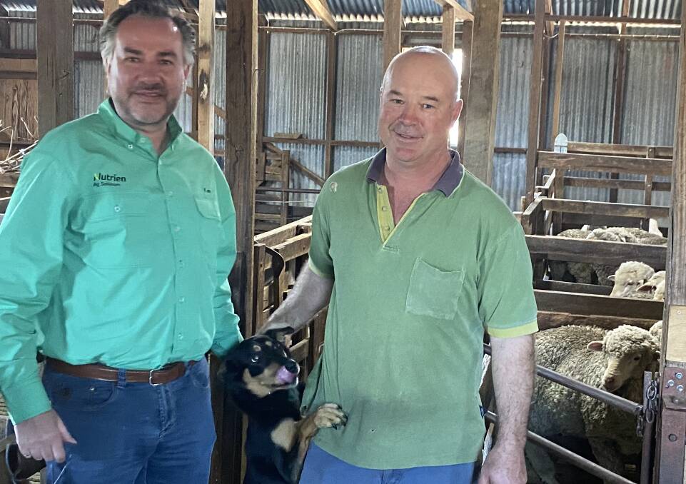 Nutrien's interim president, Ken Seitz, with southern NSW farmer Scott Schlunke, Hillgrove, Bowning and kelpie, Penny, during his eastern Australian visit.