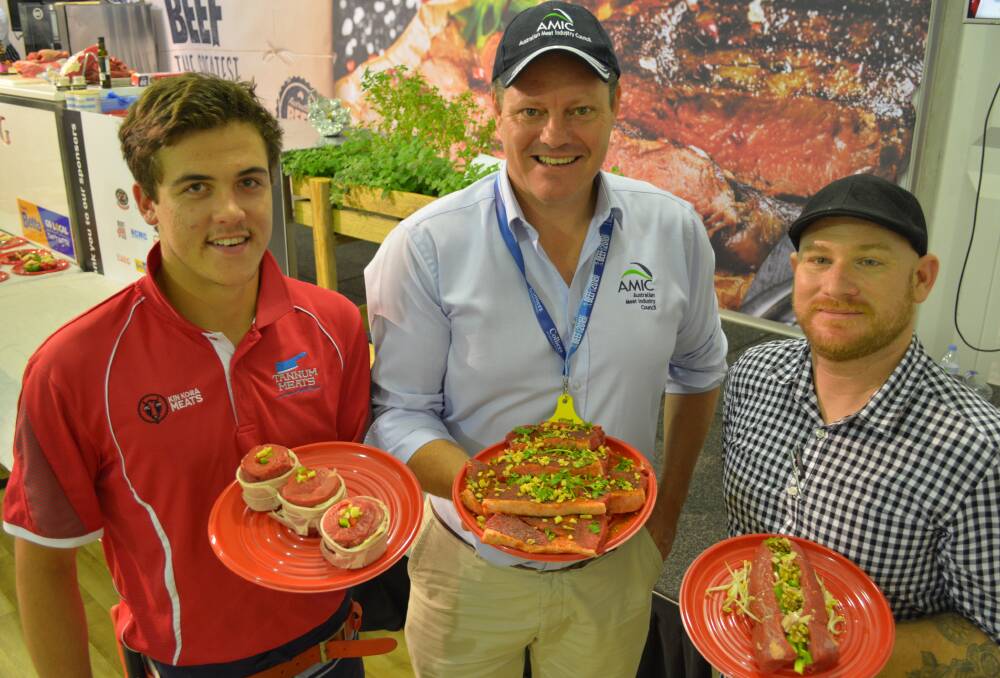 What's for dinner? Apprentice butcher, Matt Wilson, Kin Kora Meats, Gladstone, Australian Meat Industry Council chief executive officer, Patrick Hutchinson, and principal of Parkhurst Quality Meats, Rockhampton, with some of the meal options served up by butchers at Beef Australia last month.