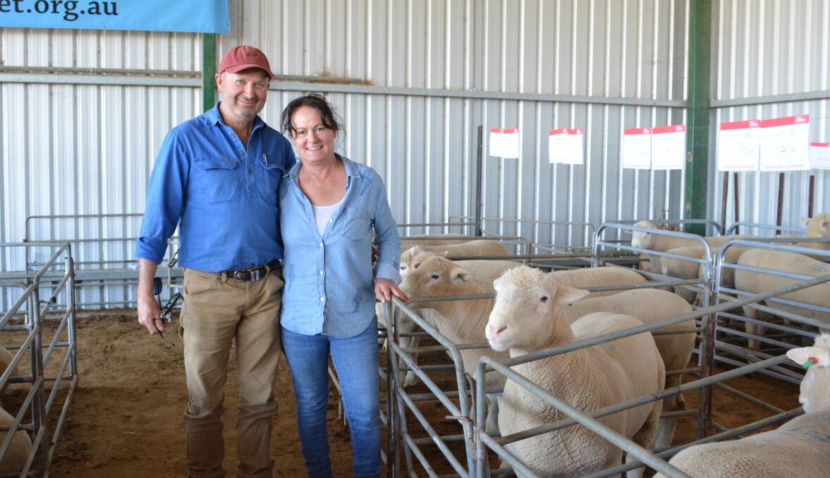 Hugh and Fran Flanery of Kalangan, Galong, with a spring-drop ram they purchased for $3000. They took home four rams total for a $2400 average. 