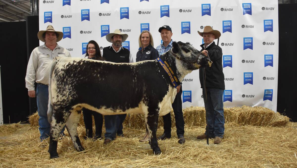 Another view:(from left) Vendors Tim Bell and Svetlana and Greg Ebbeck, Six Star stud,  buyers Roz and Peter Alexander, Hidden Valley stud, and handler Erin Grylls with the world record priced Speckle park female. Photo: Nathan O'Sullivan