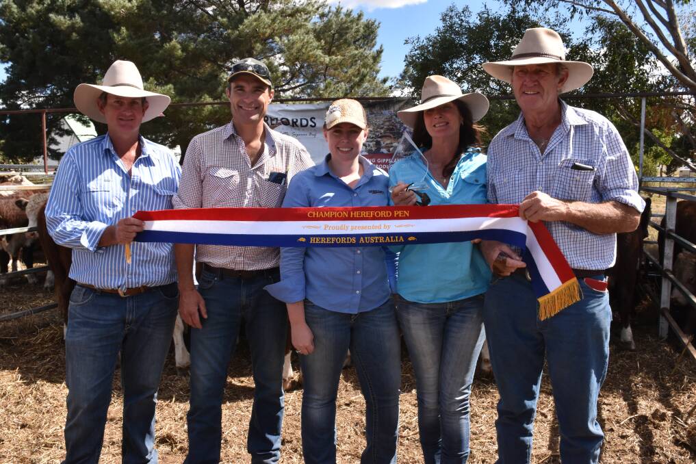 Peter Sykes, Herefords Australia, judge Jason Ronalds, and Hannah Bourke, Herefords Australia, awarded best presented pen to Di and Clive Anderson, Benambra.