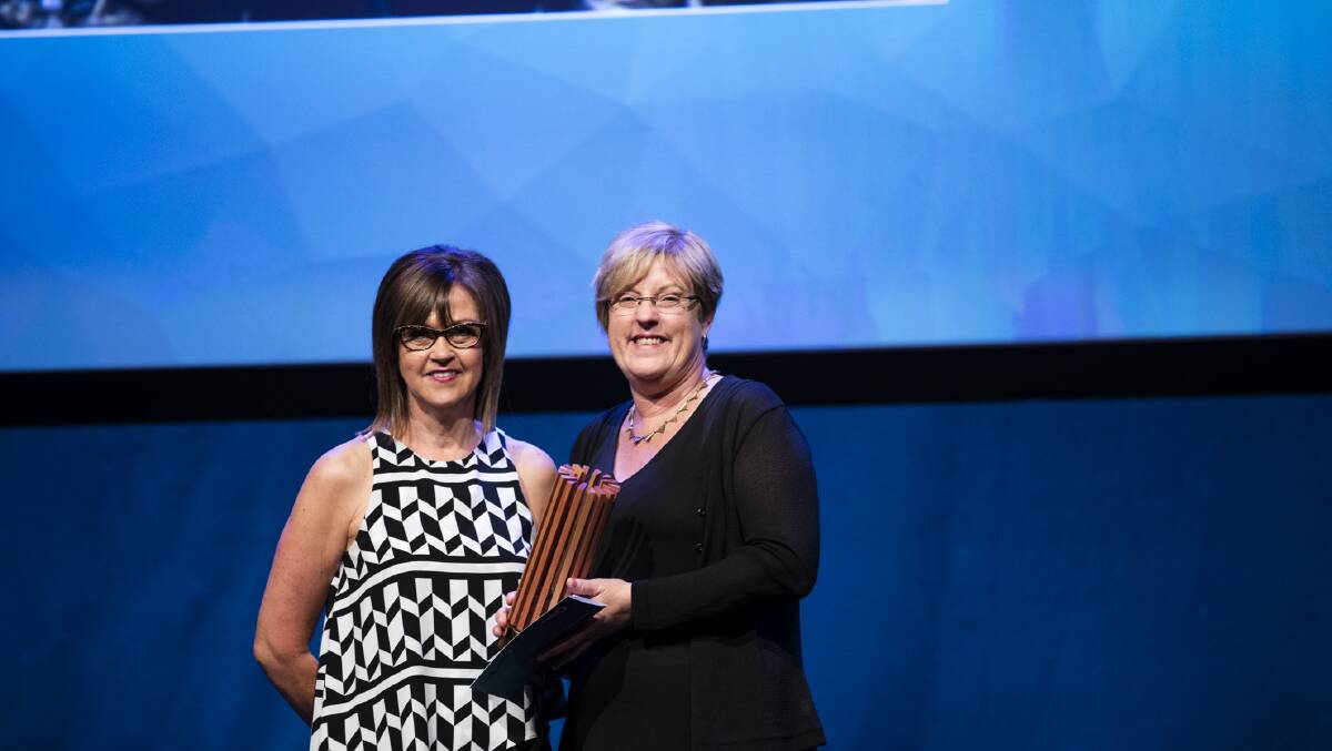 Barwon Health won the Premier's Regional Recognition Award for their Food Services Central Production Unit Recycling Initiatives program; pictured is Bronwyn Alymer, its waste management and cleaning standards co-ordinator, accepting the award from Environment Minister Lisa Neville.