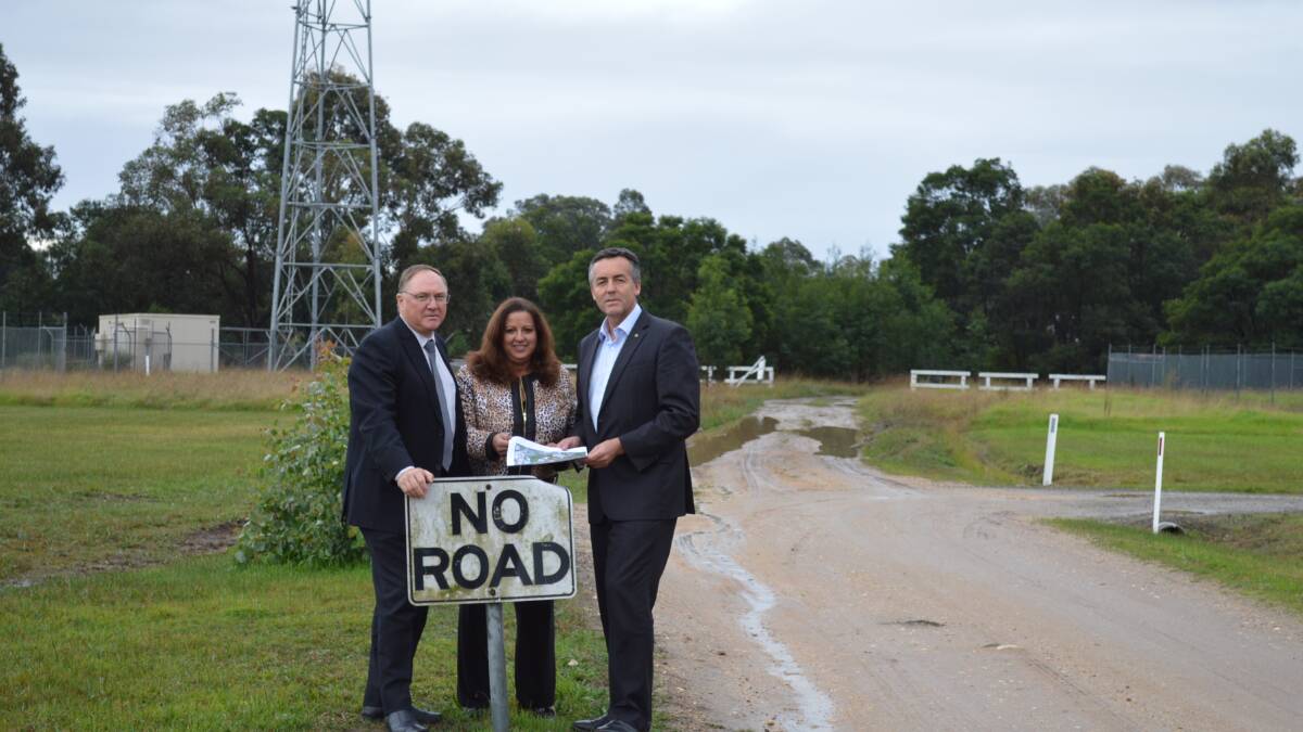 East Gippsland Shire Council chief executive Gary Gaffney, mayor Maryanne Pelz and Federal Gippsland MP Darren Chester at the end of Giles St in Bairnsdale, which will be extended north to provide an alternative route to the East Gippsland Livestock Exchange.