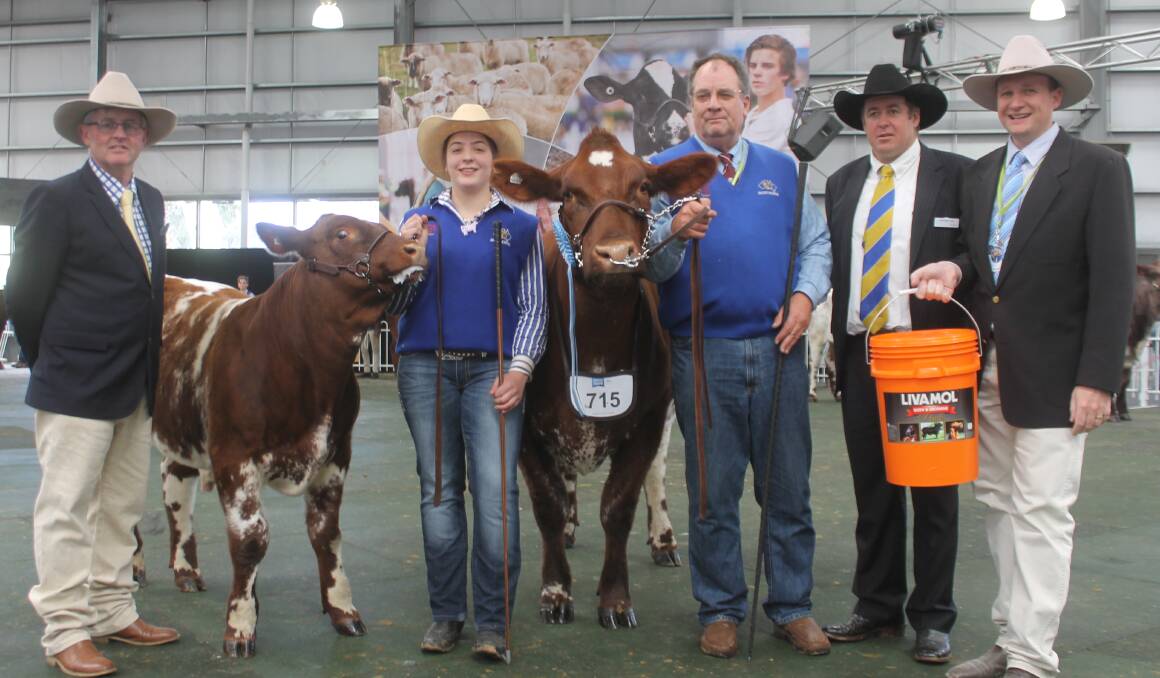 RASV's David Bolton, Claudia and David Spencer, judge Nic Job and sponsor Jason Sutherland, International Animal Health, with the supreme winning cow.