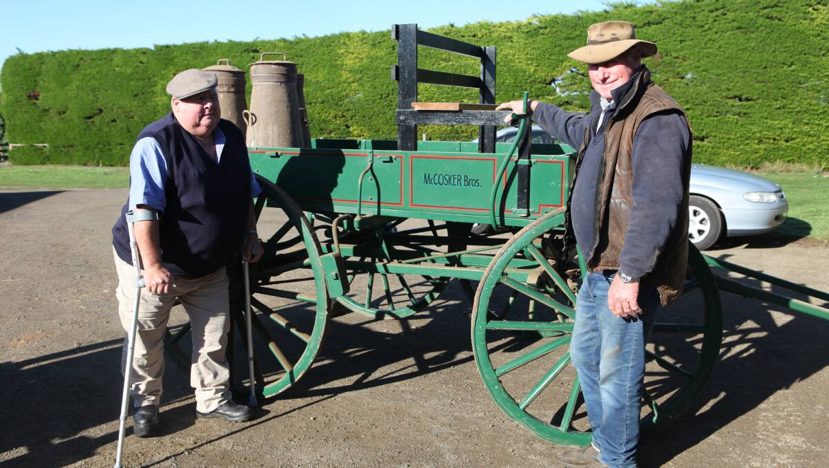 LONG-TIME SUPPORTERS: Illowa's Norm McCosker (right) with brother Billy stand in front of a wagonette, identical to the cart the pair's parents used to transport milk in cans to the Dennington factory. Photo by Rachael Houlihan.