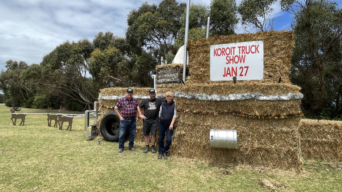 Koroit Agricultural Society committee members Graham Morris, Richard Allen and Julie Houlihan in front of the Koroit Truck Show hay bale display. 