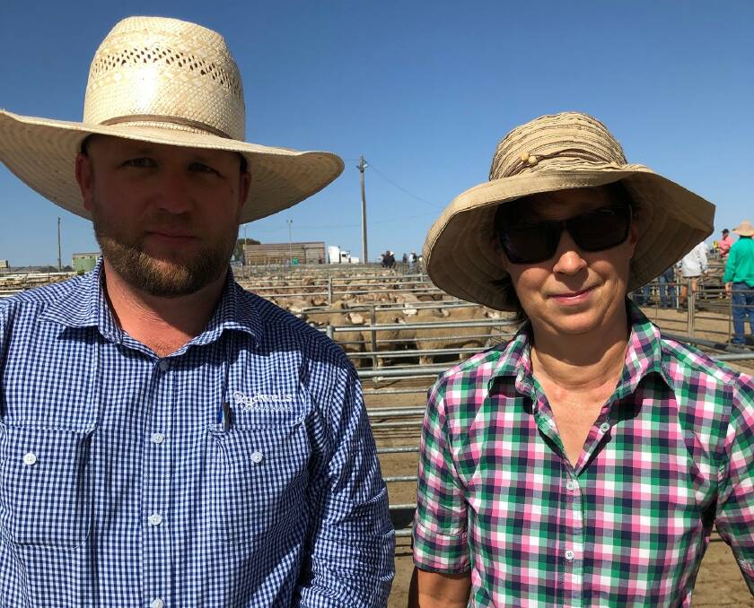 MARKET WATCH: Adam Roberts from Rodwells with Judy Jackel from Corowa watch the family lambs sold that made $114.00.