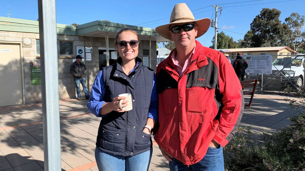 MARKET OBSERVERS: Kimberley Rowe with Martin Williams, Elders, at the Ouyen sheep sale recently.