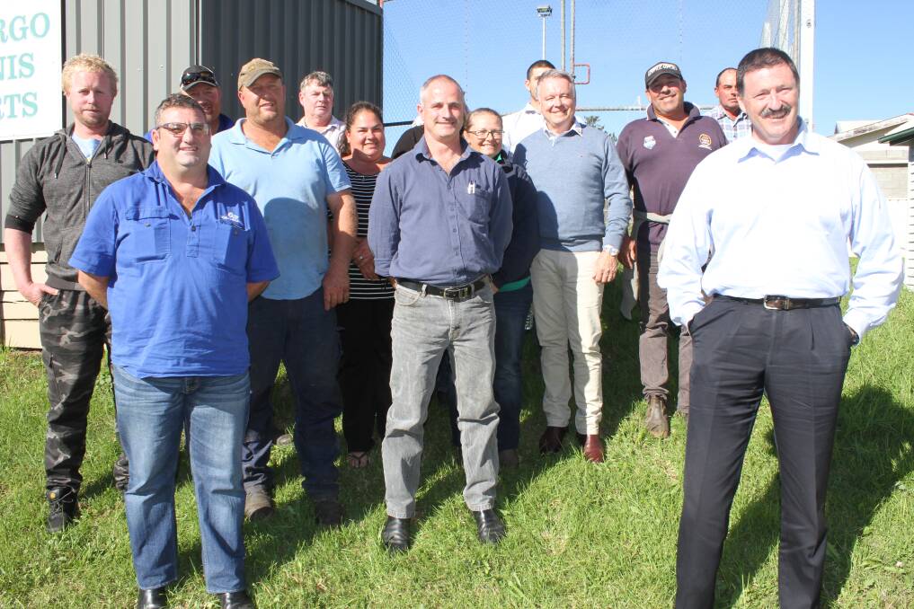 Shadow Minister for Agriculture Joel Fitzgibbon speaks with a group of dairy farmers in Cobargo. Photo: Alasdair McDonald.