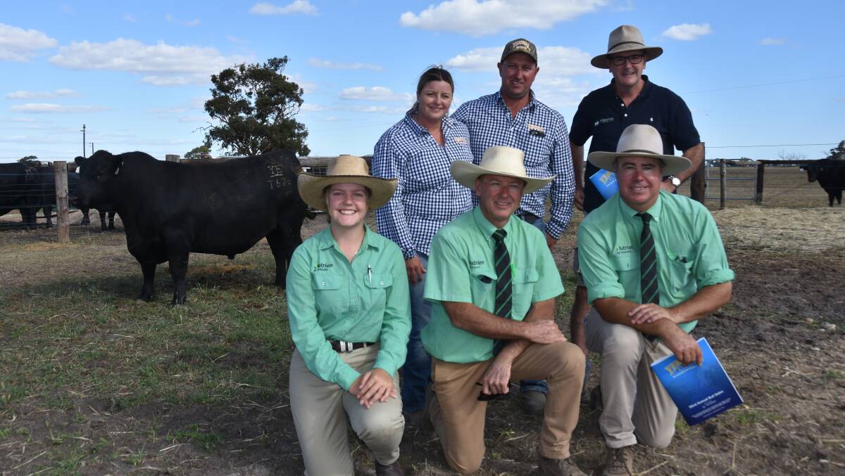 Yerwal Estate stud principals Connie and Regan Burow with buyer of the $53,000 bull, Lachlan McKenzie, Ballarat, Vic. Kneeling at front are Nutrien Naracoorte's Ella Littlejohn and Richard Jennings and Nutrien stud stock auctioneer Richard Miller. Picture by Catherine Miller