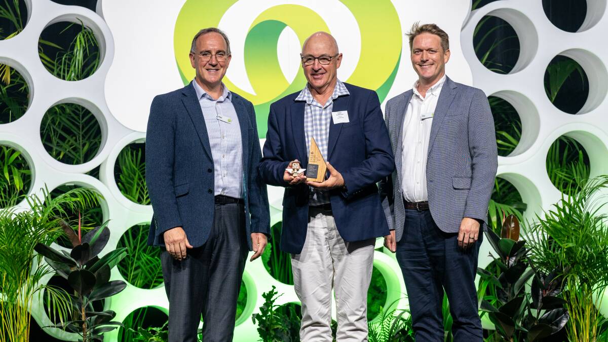 Woolworths chief commercial officer Paul Harker and commercial director of meat Tim Dunning present the award for supplier of the year in meat and seafood to WA feedlot operator Paul O'Meehan (centre). Picture via Woolworths.