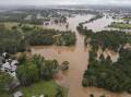 ON ALERT: Floodwaters flowing through Gympie. Source: EPA/Queensland Fire and Emergency Services.