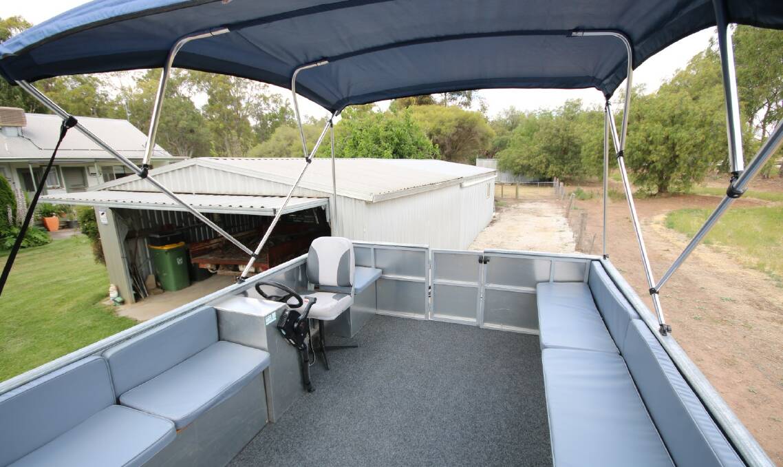 Up to seven party-goers can fit into this fun boat being offered as a sweetener for this property sale with Murray River frontage in northern Victoria. Pictures from Luke Ryan Real Estate.