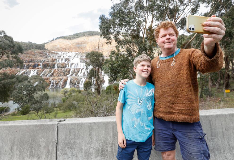 Angus M'Crystal, 12, travelled from Yackandandah with his dad, Hugh, when the spill began at Dartmouth to witness the history-making event. Pictures by Border Mail, Albury.
