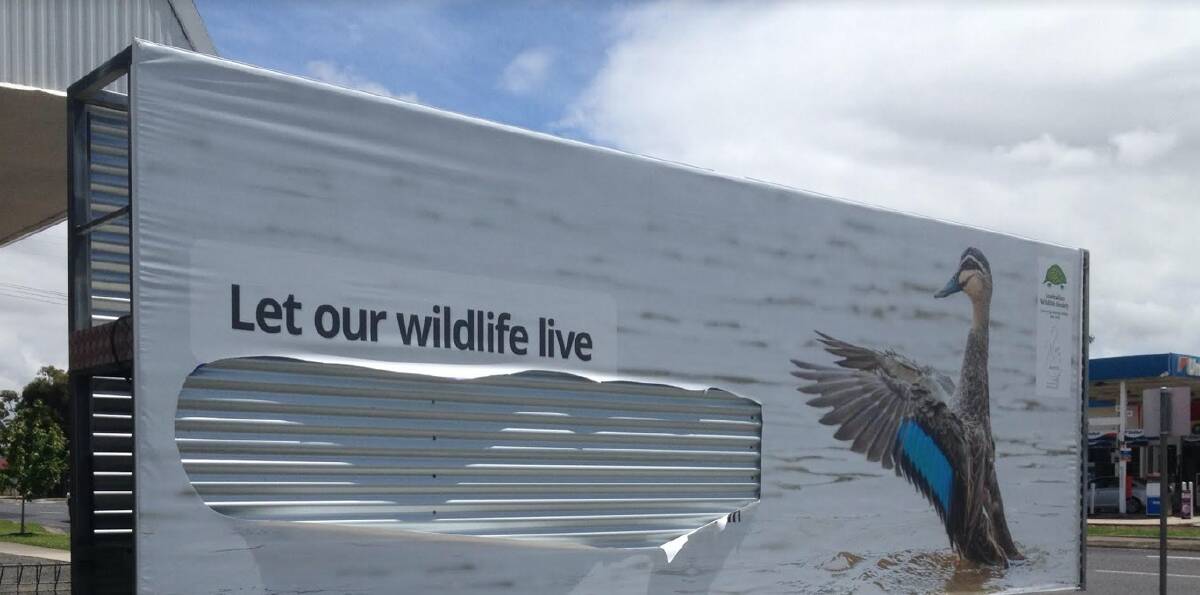 AFTER THE ATTACK: The core message asking for a ban on duck shooting was removed from the sign, and a knife was left at the scene. Pictures: Australian Wildlife Society.