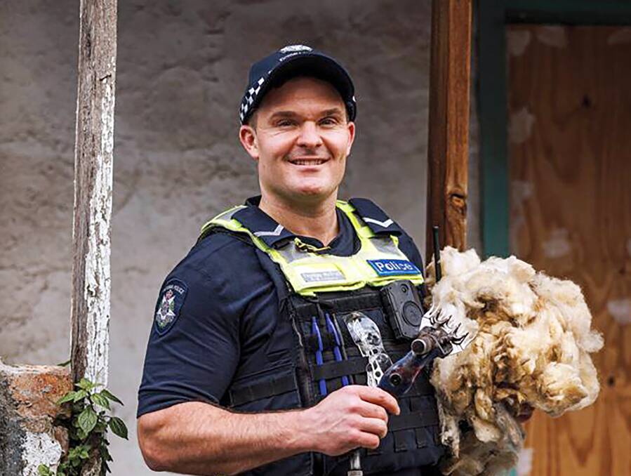 Here hold this, police recruiters convinced First Constable Tom McGrath from Minyip to hold this handpiece and fleece to help lure more recruits to country policing. Pictures Victoria Police.