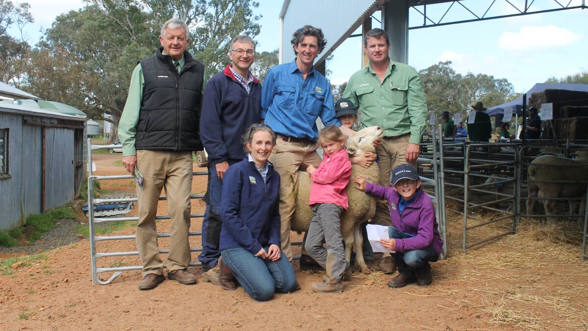 Principals Chris and Kate, kneeling, Dorahy, their children Harry, Rupert and Bridie, with Landmark agents Andrew Sloane and Rick Smith and client Allan Millard, Welbanite.