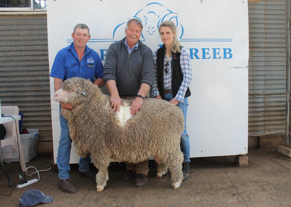 Nareeb Nareeb's Richard Beggs holds the top priced ram purchased by Glenthompson Pastoral with Frazer McKenzie, Arcadian Wool and Lou Mann, Glenthompson.