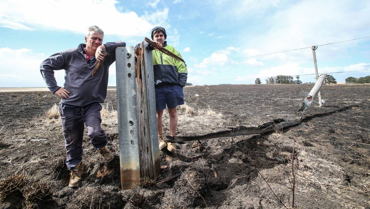 BUSHFIRE: Bernie Harris and Jack Kenna Junior with the pole that snapped and caused The Sisters/Garvoc bushfire.