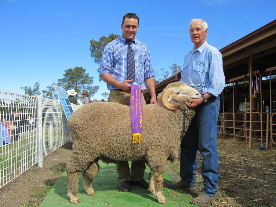 Ralph Diprose, Rocklyn, right, with Grenfell Show judge Aaron Seaman and the grand champion merino entry at the Grenfell Show 2013.