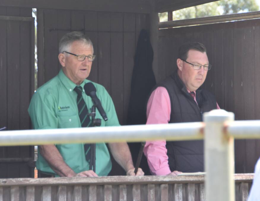 AT THE HELM: Andrew Sloan, Nutrien, and Ross Milne, Elders, during the Melville Park sale.