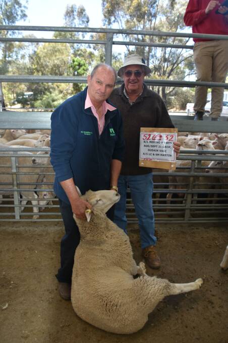 Agent Graeme Summerhayes, Rainbow, and Jim Gibson, Beulah West with one of the ewes Mr Gibson purchased.