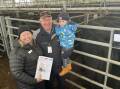 Generosity: Euroa Health manager Melissa Seymour with board member Chris Thomson and Fred Swift, 3, who received a five-figure donation from livestock buyers and farmers at Euroa.