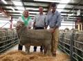 Lucy Gray, Melton Mowbray, Tas, John Williamson, Whorouly, and Stockman stud manager Kip Gray, Melton Mowbray, Tas, with the top-priced ram. Picture by Flea McShane
