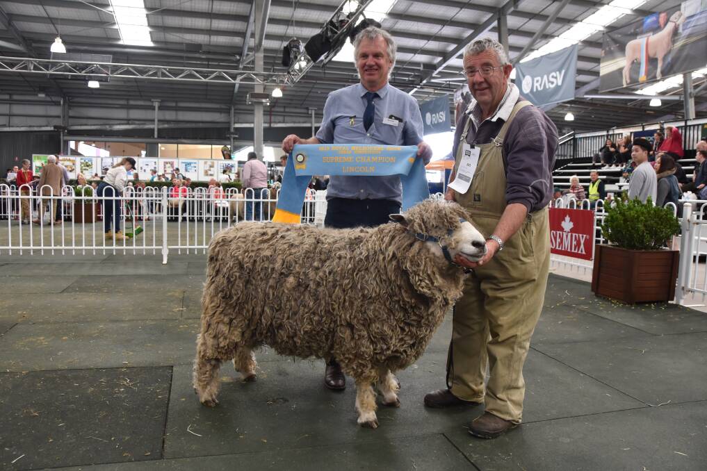 NO SHOW: Ian Christie, with the Supreme Champion Lincoln, at last year's Royal Melbourne Show, with judge Nick Cole. 