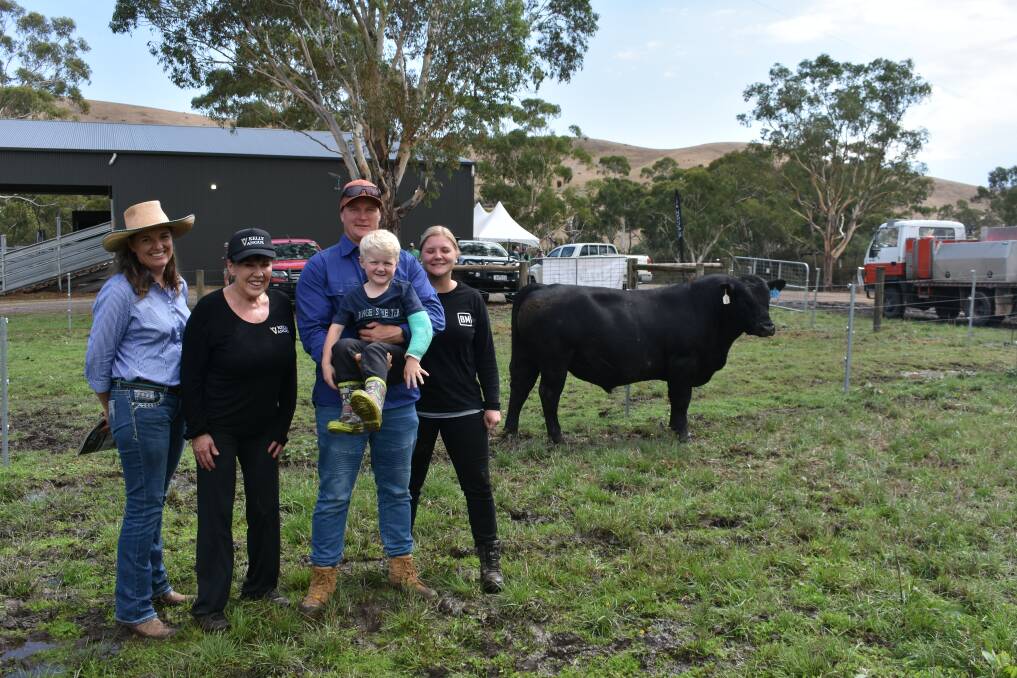 Cindy Smith and Vicki Standish, Kelly Angus, Yea, with the buyers of the top-priced bull Brad and Tegan Brookes and son Oska, four and a half. Picture by Andrew Miller